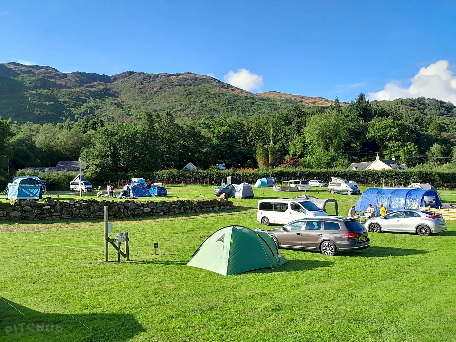 Cae Du Campsite pitches beneath the mountains near Beddgelert
