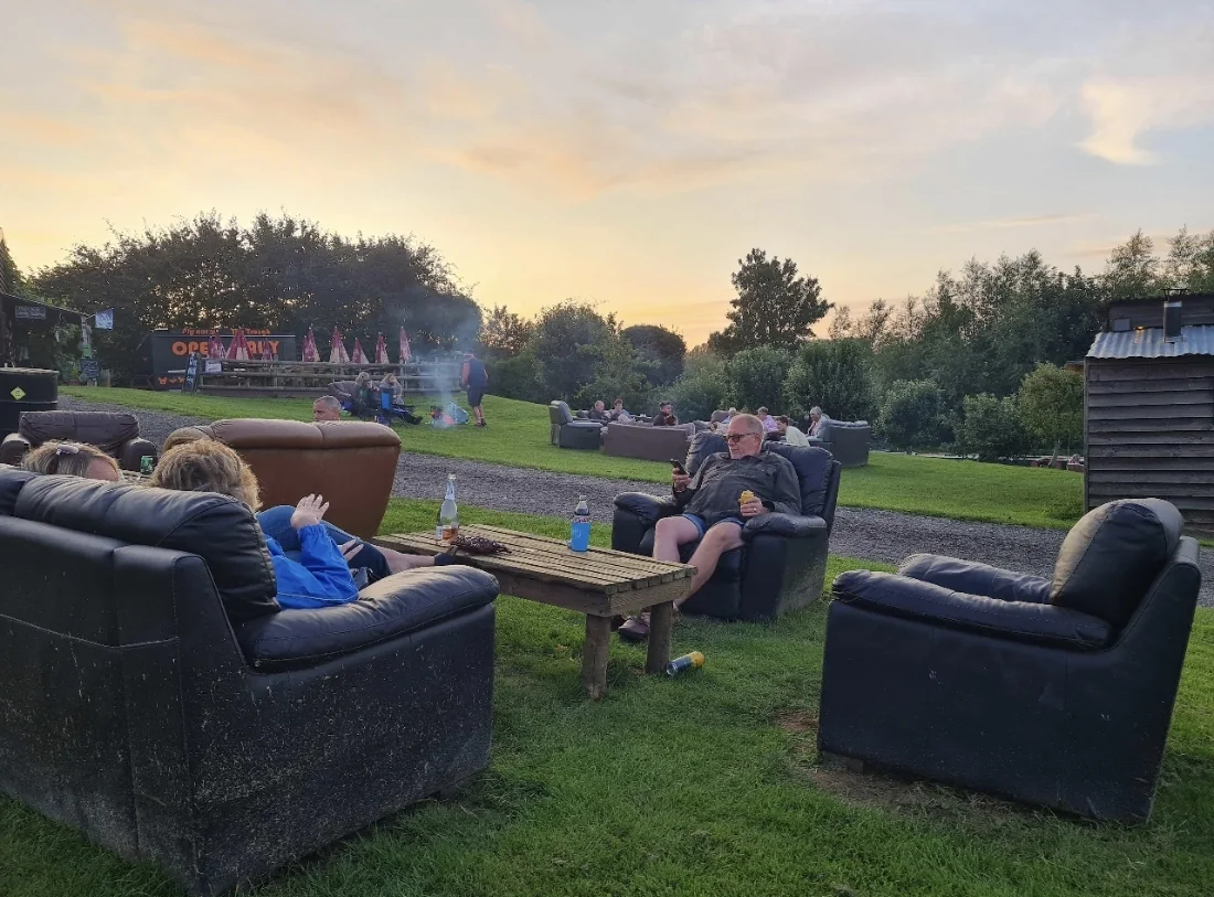 Outdoor social seating near Trotters Bar at The Pig Place
